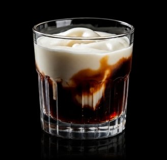 White Russian cocktail on glass surface