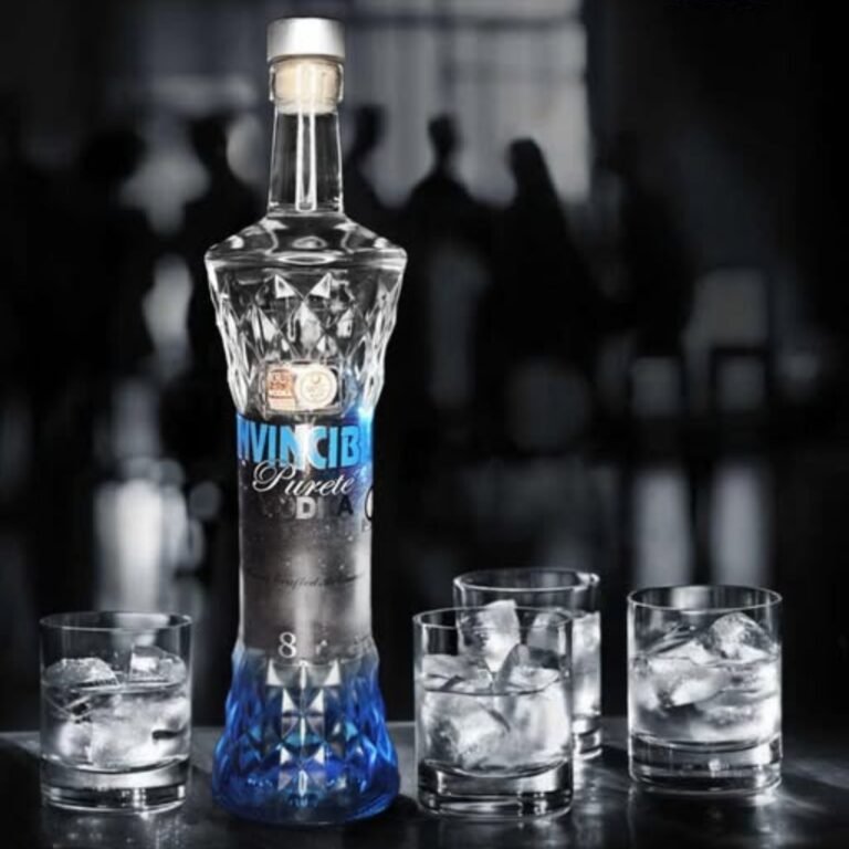 Close-up of the premium Invincible Vodka bottle displayed with crystal glasses in a luxury bar atmosphere.
